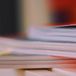 A stack of books which have been blurred.