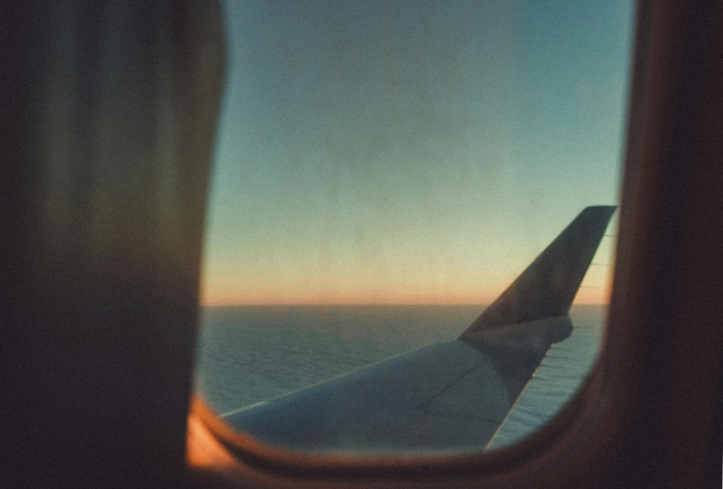 View if an aeroplane wing from the cabin window