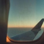 View if an aeroplane wing from the cabin window