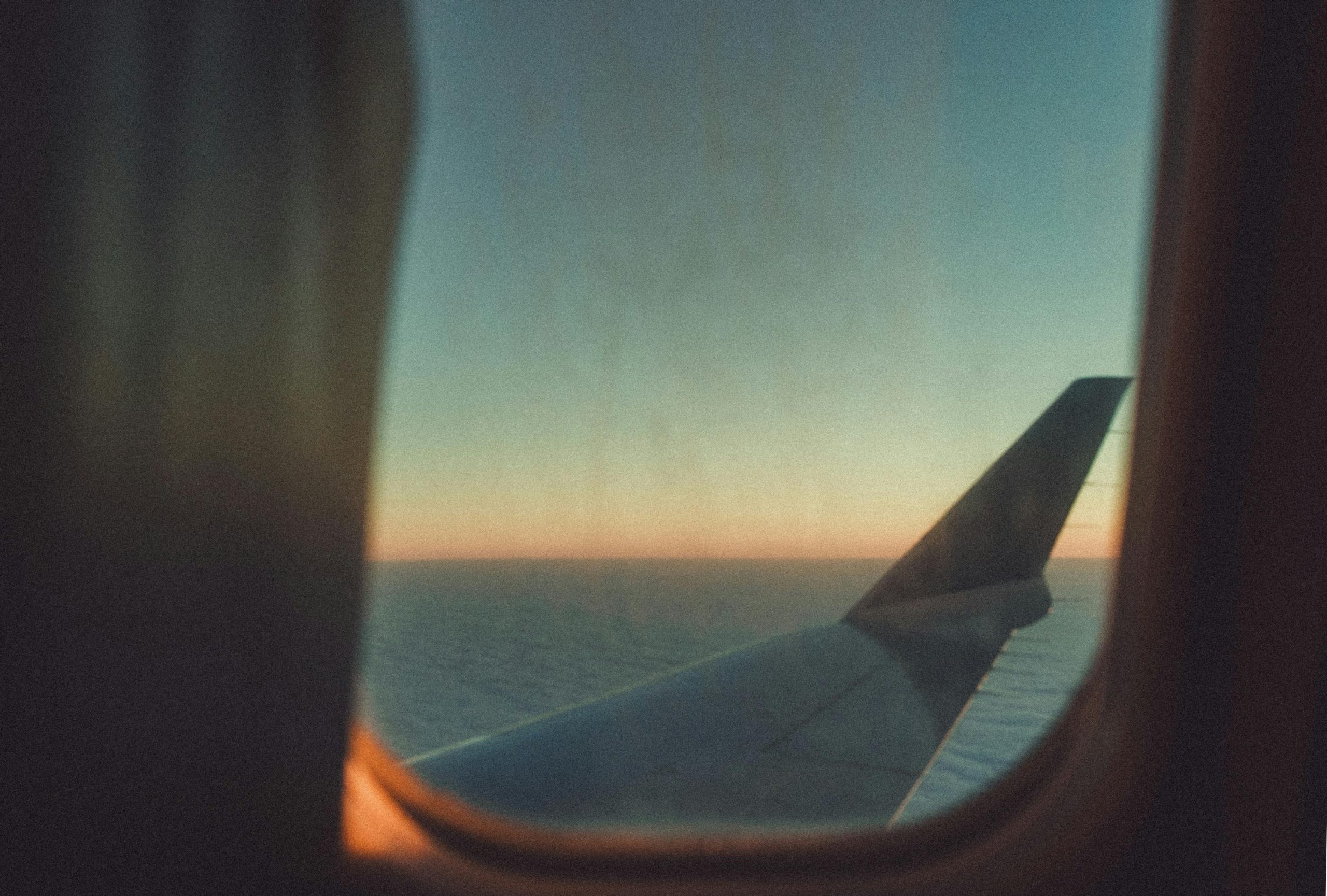 View if an aeroplane wing from the cabin window
