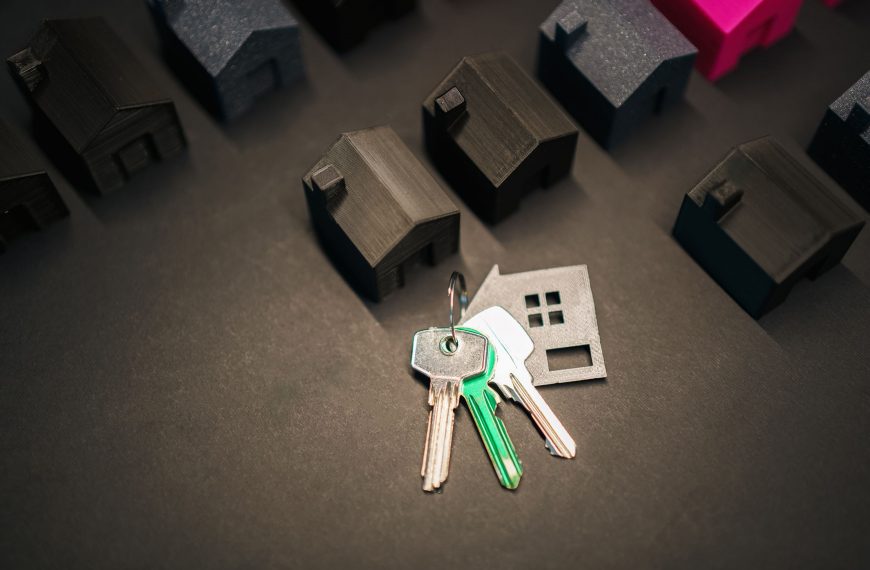 A birds eye view of a set of keys amongst small models of houses